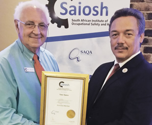From left: Saiosh president, Robin Jones, handing over an honorary membership certificate to Tibor Szana, chief inspector at the Department of Labour.